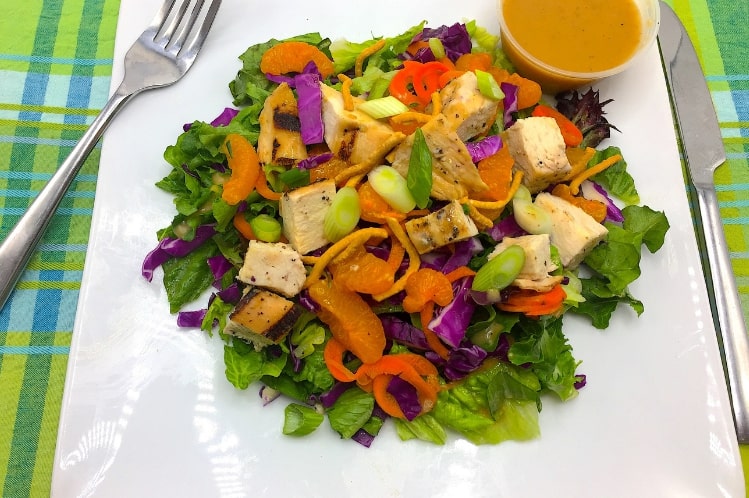 Grilled mandarin orange chicken salad with red cabbage, crispy noodles and sesame ginger vinaigrette.