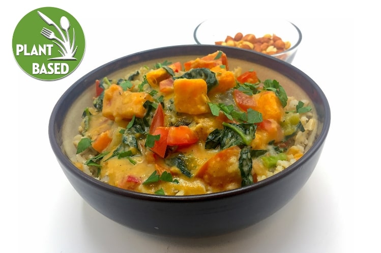 West African sweet potato and peanut stew with brown rice, kale and roasted peanuts