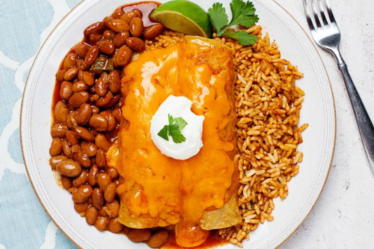 Chicken Enchiladas with Spanish Rice and Pinto Beans from Meal Village prepared meal delivery