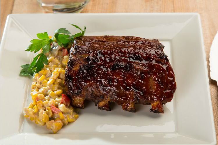 BBQ Baby Back Ribs Over Cajun Corn Maque from Meal Village prepared meal delivery