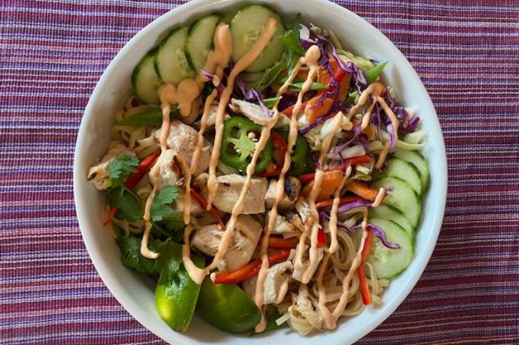 Bangkok noodle bowl with sesame soy grilled chicken, rice noodles and ginger radish slaw