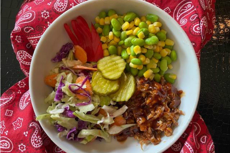 Southern BBQ pork bowl with shredded pork shoulder, buttered corn, lima beans, cole slaw and pickles
