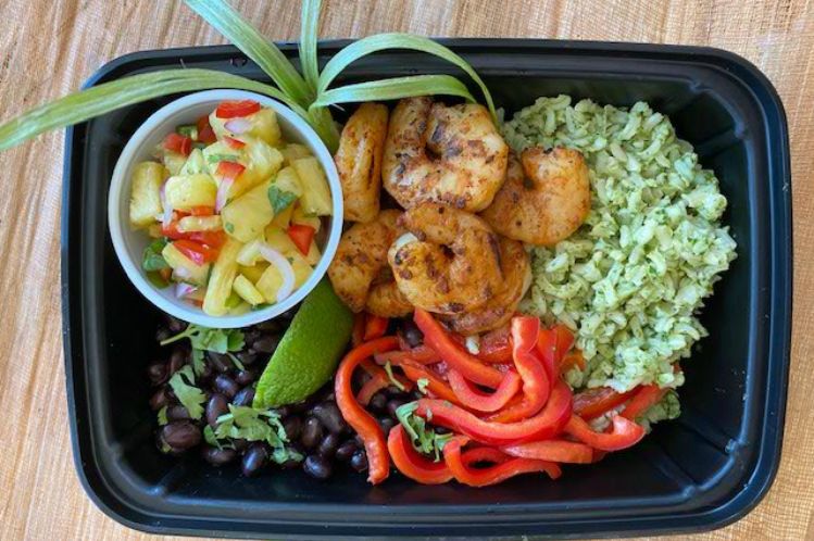 Shrimp taco bowl with grilled gulf shrimp, brown rice, black beans and fresh pineapple salsa
