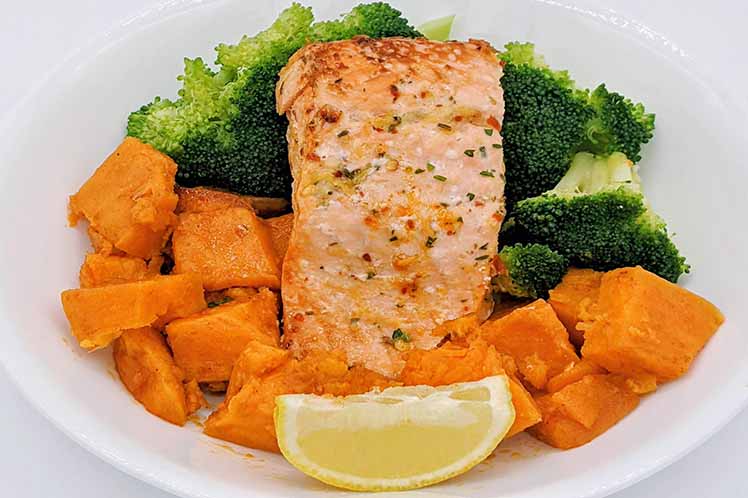 Lemon roasted salmon entree with sweet potatoes and broccoli from Meal Village