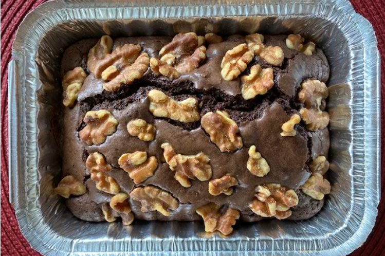 Walnut fudge brownies topped with toasted walnuts.